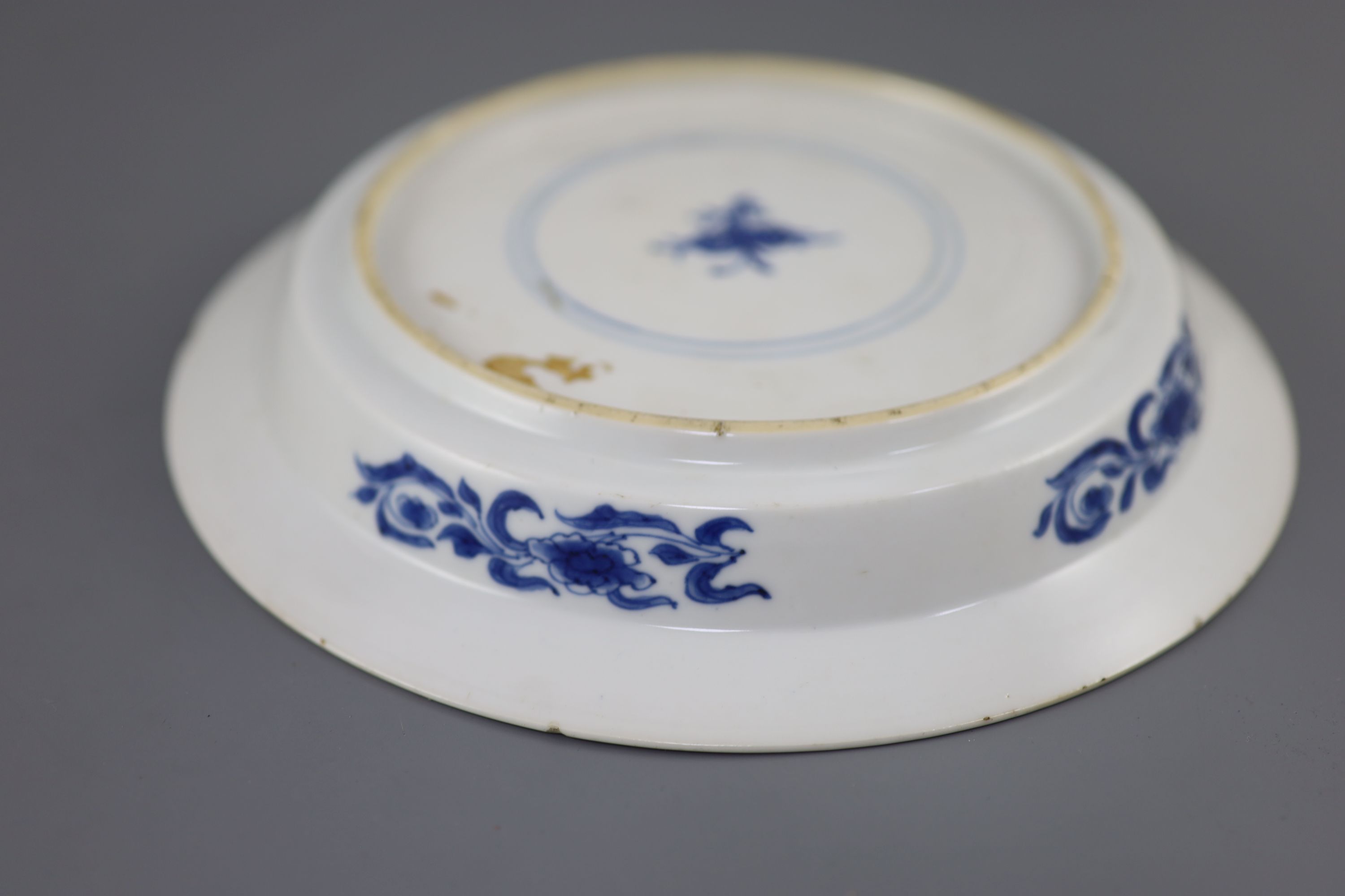 A Chinese blue and white sage and phoenix dish, Kangxi period, 20.8cm diameter